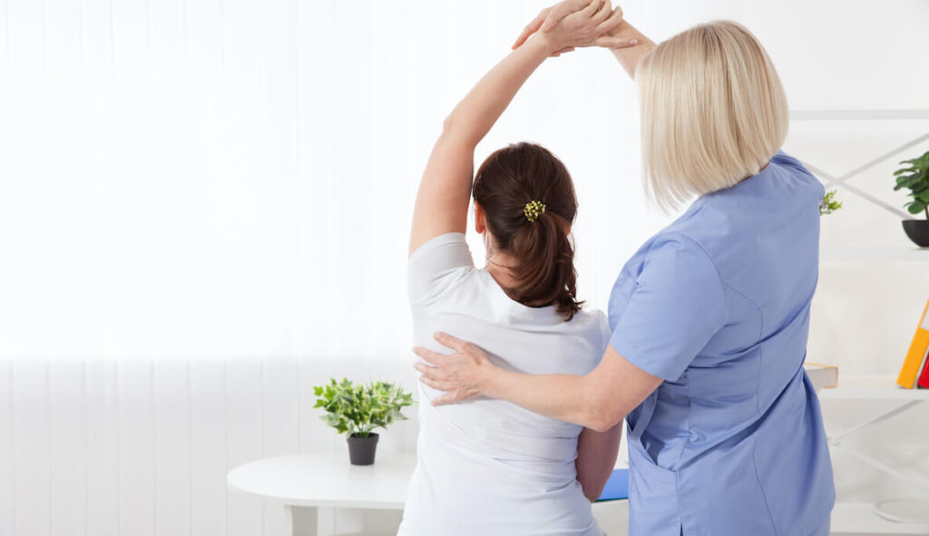 Physiotherapy, sport injury rehabilitation treatment. Woman having chiropractic back adjustment. Osteopathy, Alternative medicine, pain relief concept.
