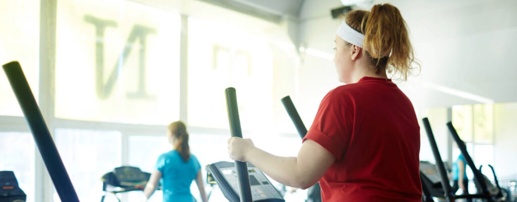 How Post-Op Rehab Helps With Pain Management After Surgery, A Woman In A Red Shirt Uses A Treadmill