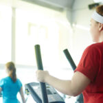 How Post-Op Rehab Helps With Pain Management After Surgery, A Woman In A Red Shirt Uses A Treadmill